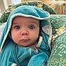 baby, infant, face, blue_eyes, blanket, hood, cushion, pattern, fox, green, teal, clothing, indoor, portrait, curious, child, seated, home, soft_light, closeup