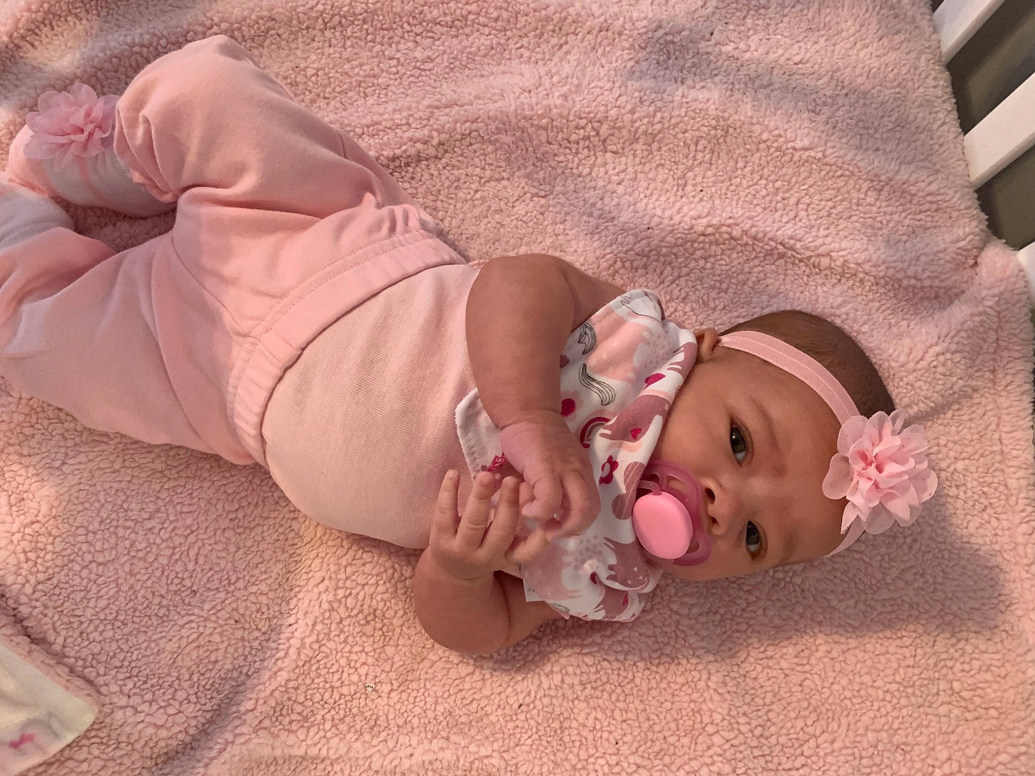 Storm is registered to the contest to win money with this photo: baby, birth, child, ear, head, headwear, mouth, person, pink, skin, toddler