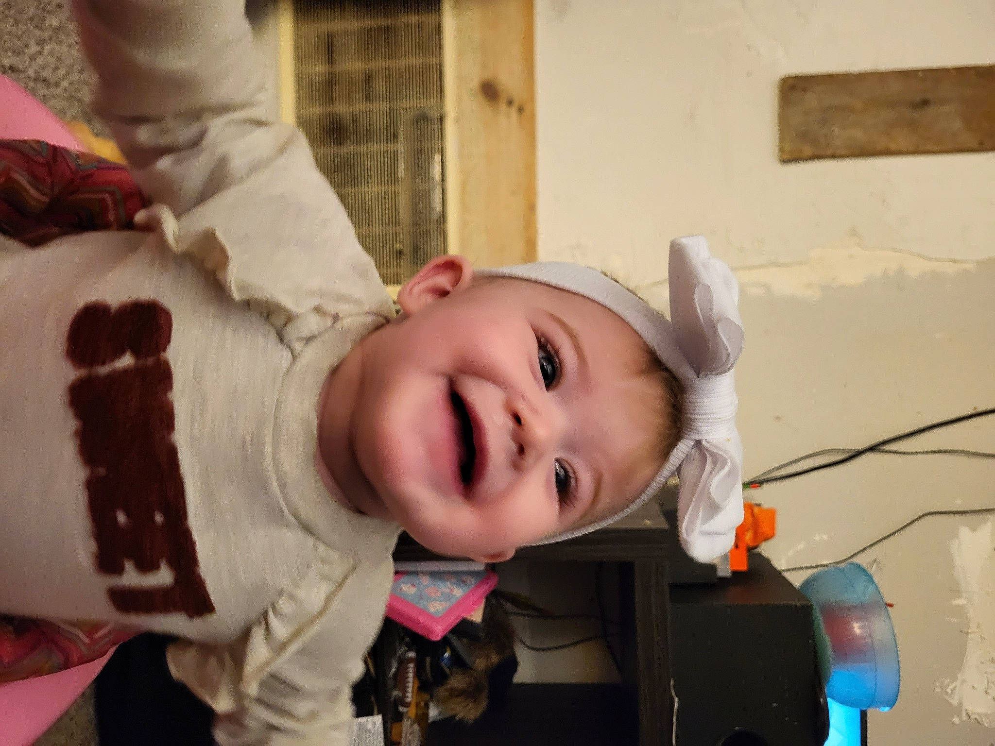 Nevaeh is registered to the contest to win money with this photo: baby, baby_toddler_clothing, cheek, child, fun, fur, happy, hat, headwear, human_body, joy, laugh, leisure, lip, mouth, nose, person, portrait_photography, sitting, skin