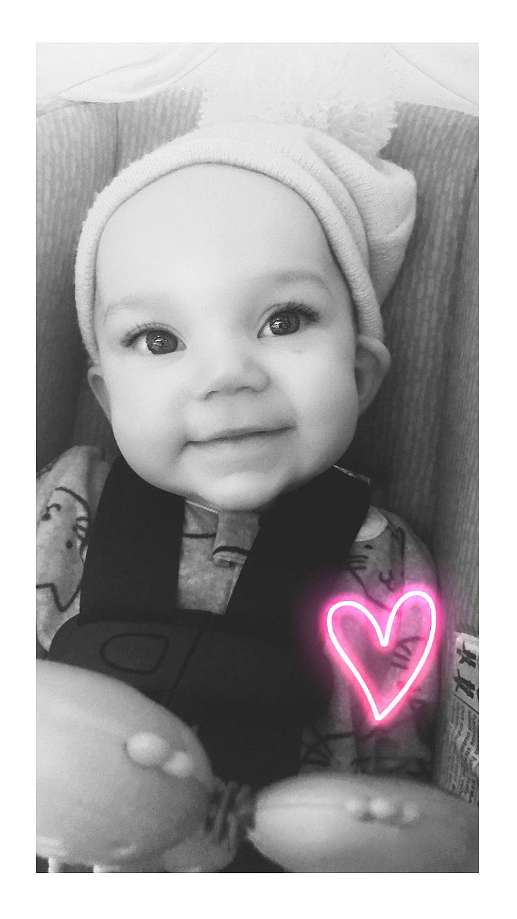 Taryn is registered to the contest to win money with this photo: baby, black_and_white, cheek, child, face, happy, head, headwear, monochrome, monochrome_photography, person, photograph, photography, portrait, portrait_photography, smile, snapshot, stock_photography, style, toddler