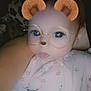 baby, child, face_filter, bear_ears, glasses_filter, baby_clothing, onesie, floral_pattern, infant, portrait, cute, digital_filter, indoor, person, young_child, head_and_shoulders, closeup, soft_lighting, baby_girl, expression