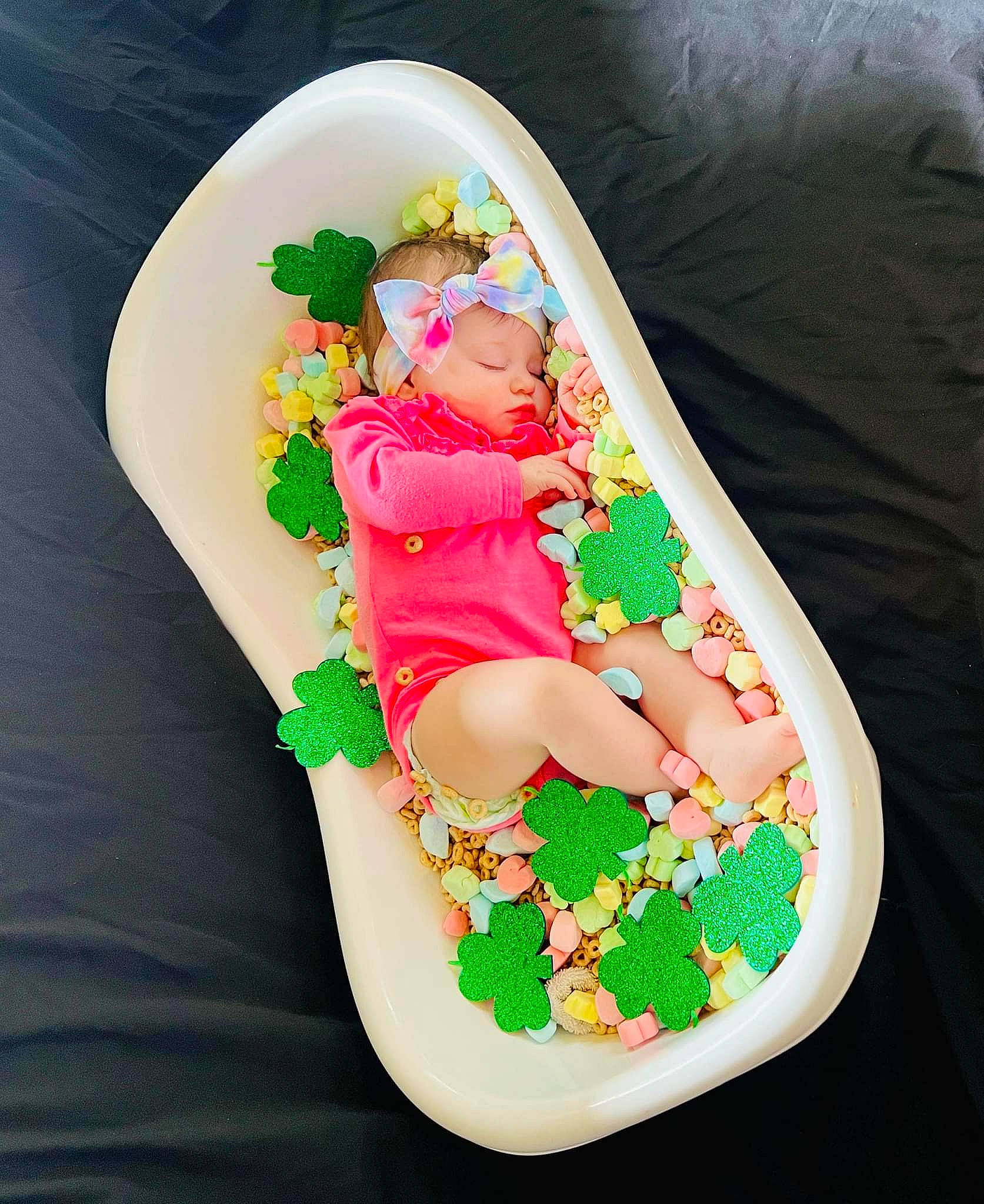 Stormy is registered to the contest to win money with this photo: arm, baby, baby_products, baby_toddler_clothing, carmine, comfort, dishware, fictional_character, finger, hand, headwear, houseplant, human_body, lap, leg, linens, person, sandal, sleeve, sweetness