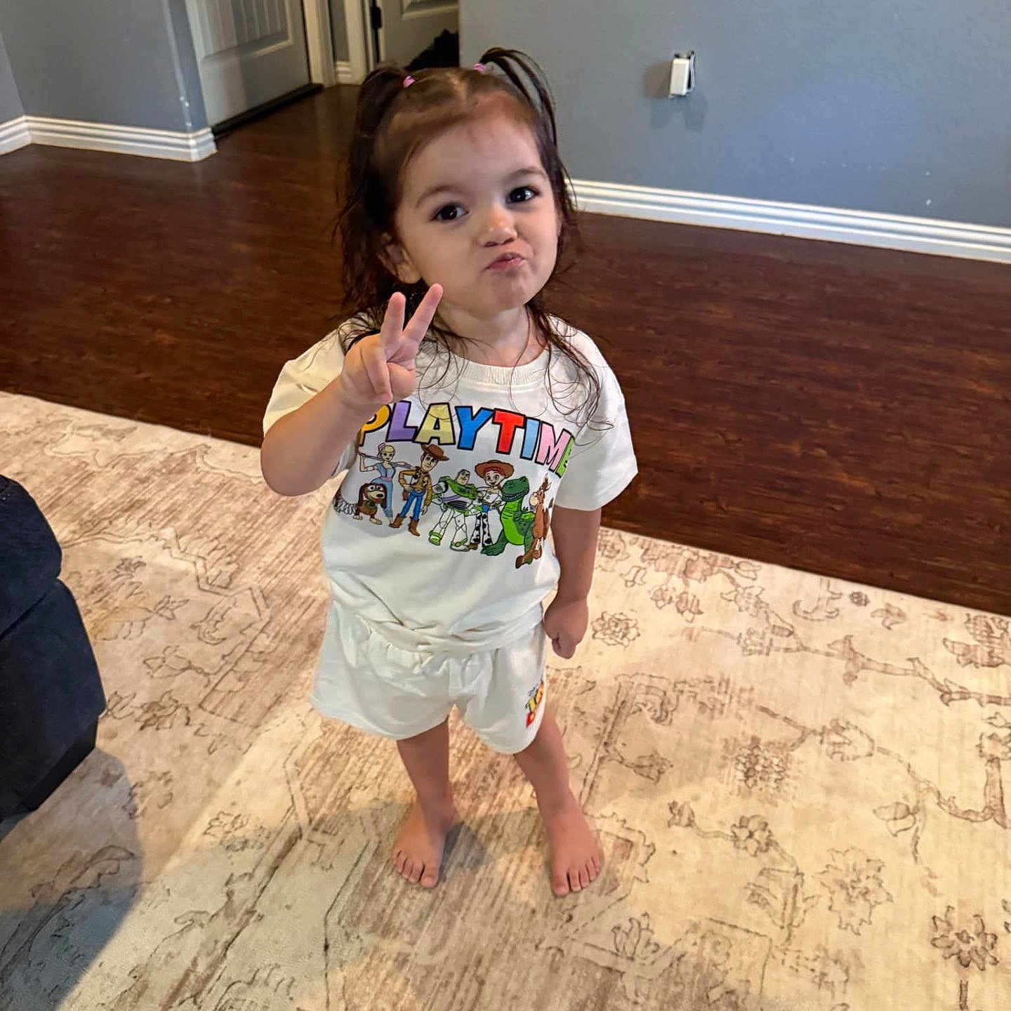 Elliana joined the competition — help win amazing prizes! bodypart, child, clothing, door, face, female, finger, girl, hand, hardwood, head, pants, person, photography, portrait, shorts, sitting, sleeve, t_shirt, wood