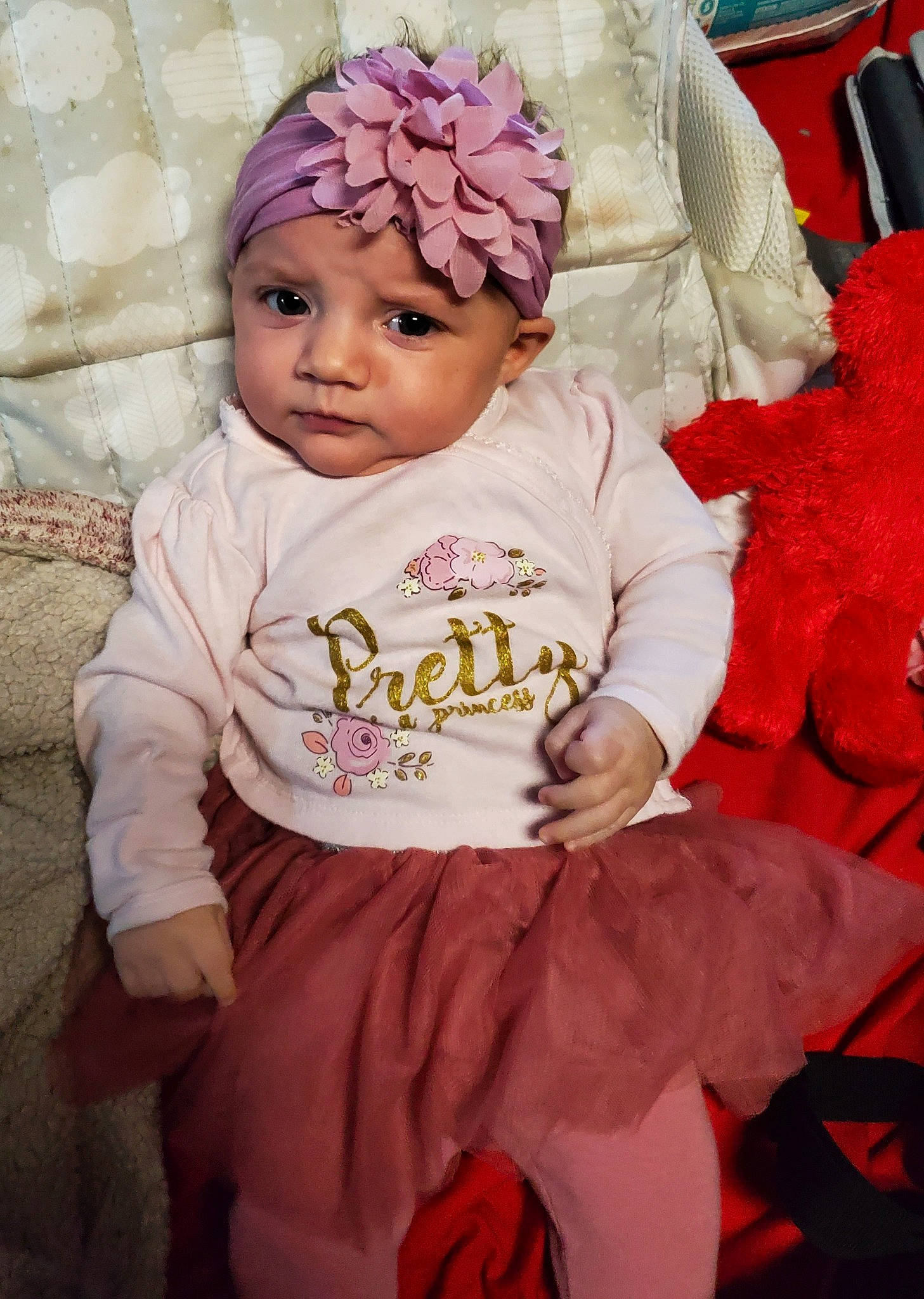 Caralyn is registered to the contest to win money with this photo: baby, baby_toddler_clothing, cap, cheek, child, facial_expression, fashion, happy, headband, headgear, headpiece, headwear, knit_cap, magenta, mammal, person, pink, red, skin, sleeve