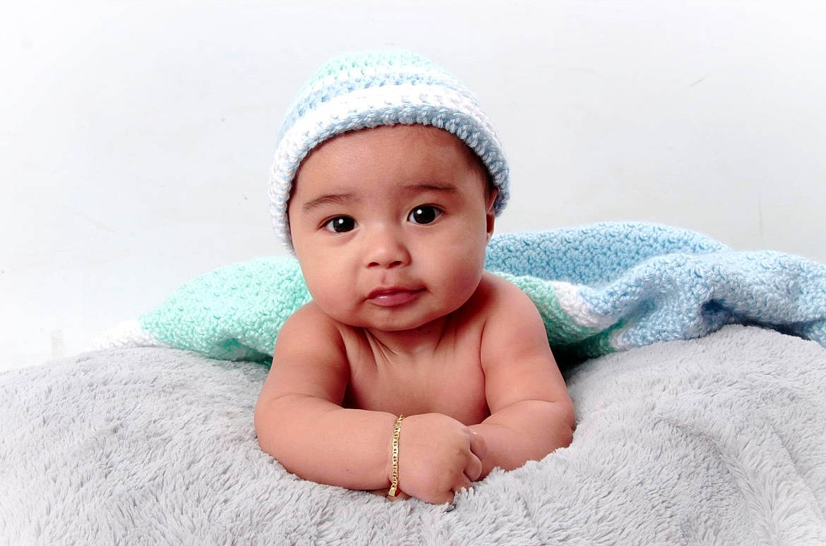 Sebastian joined the competition — help win amazing prizes! baby, baby_toddler_clothing, beanie, cap, cheek, child, chin, comfort, face, fashion_accessory, flash_photography, fun, hair_accessory, happy, headwear, knit_cap, linens, person, portrait_photography, sleeve
