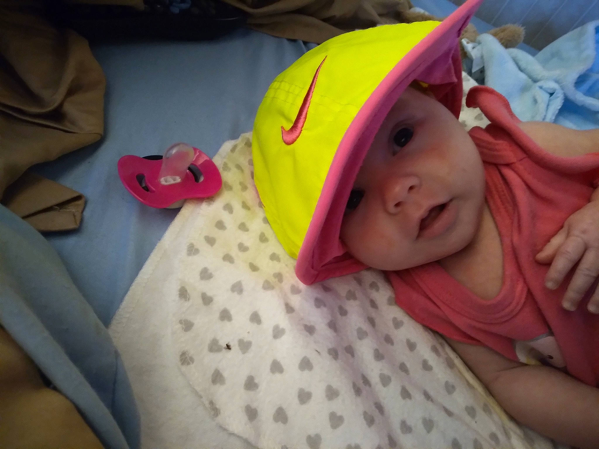 Mattie is registered to the contest to win money with this photo: baby, baby_products, baby_toddler_clothing, bedtime, cap, carmine, child, comfort, fun, happy, headwear, linens, magenta, pattern, person, pink, product, room, sleeve, smile