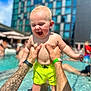 baby, child, pool, water, tattoo, arms, swim_trunks, summer, outdoor, building, sky, happy, playing, person, sunlight, fun, vacation, holding, tattooed_arms, splash