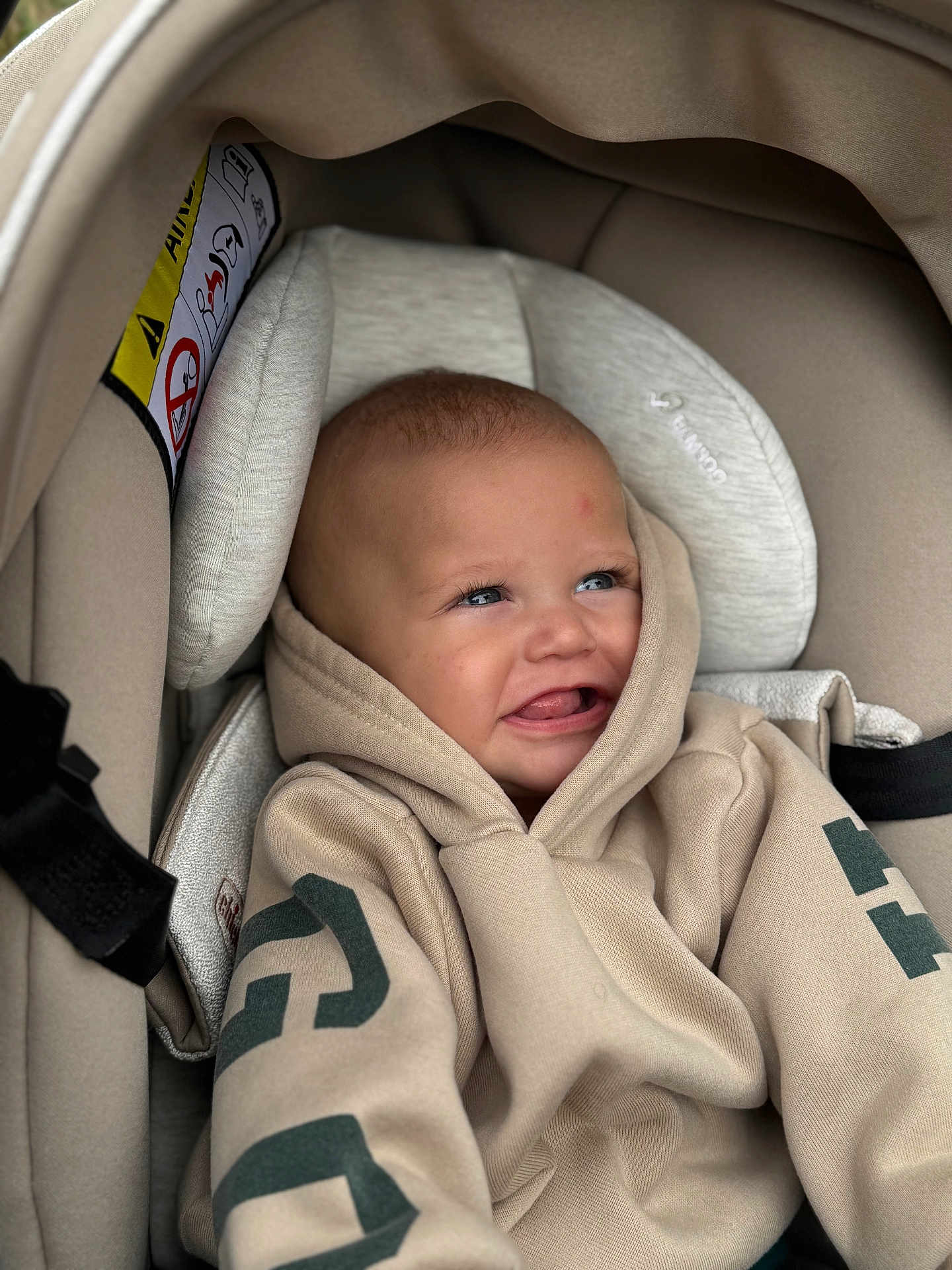 Mayson participe au concours pour gagner de l'argent avec cette photo : baby, child, hoodie, car_seat, smiling, face, blue_eyes, cozy, infant, cute, clothing, seatbelt, happy, portrait, young_child, indoors, comfort, apparel, baby_boy, casual