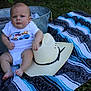 baby, blanket, cowboy_hat, outdoor, grass, metal_tub, plush_toy, child, infant, clothing, foot, hand, sitting, expression, face, head, cute, summer, texture, relaxing