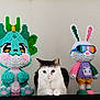 cat, toy, sculpture, dragon, bunny, colorful, shelf, indoor, animal, figure, white, gray, cute, decor, art, statue, playful, pet, feline, glasses
