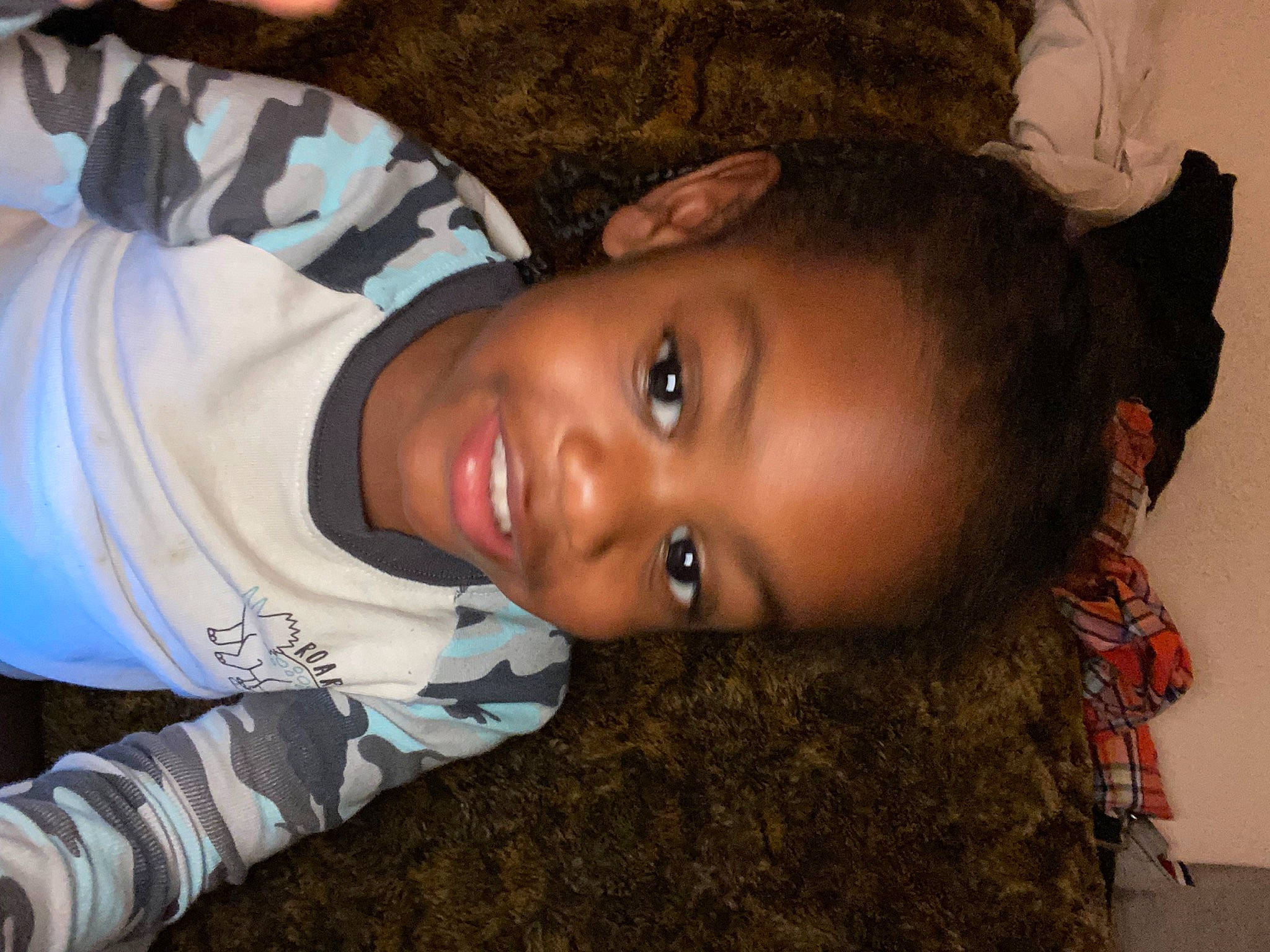 Logan is registered to the contest to win money with this photo: black_hair, cheek, child, comfort, cool, eyebrow, flash_photography, forehead, fun, happy, iris, joy, lip, mouth, neck, nose, person, plant, skin, smile