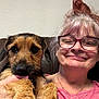 Max joined the competition — help win amazing prizes! woman, dog, pet, smiling, glasses, hair, indoor, couch, face, hand, happy, casual, closeup, portrait, furry, licking, brown, pink_shirt, necklace, friendly