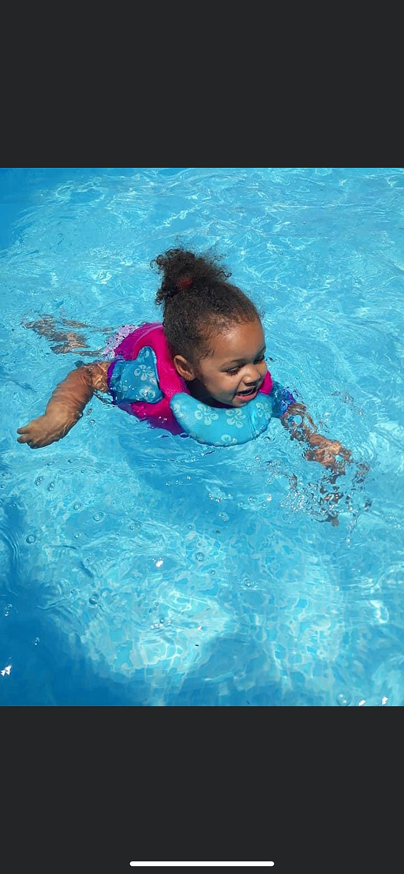 Amaris is registered to the contest to win money with this photo: aqua, baby, child, fun, games, happy, individual_sports, leisure, person, personal_protective_equipment, play, recreation, smile, summer, swimmer, swimming, swimming_pool, toddler, vacation, water