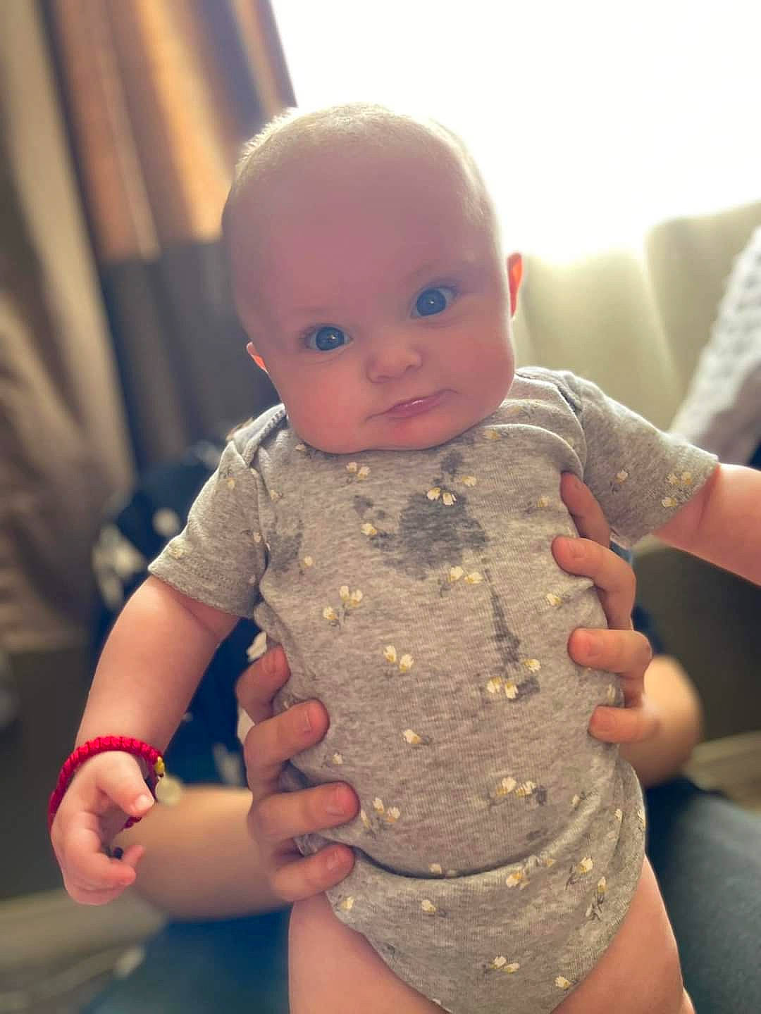 Priscilla is registered to the contest to win money with this photo: arm, baby_toddler_clothing, cheek, chest, chin, eye, face, finger, gesture, hand, head, human_body, iris, joint, lip, mouth, nose, person, skin, sleeve