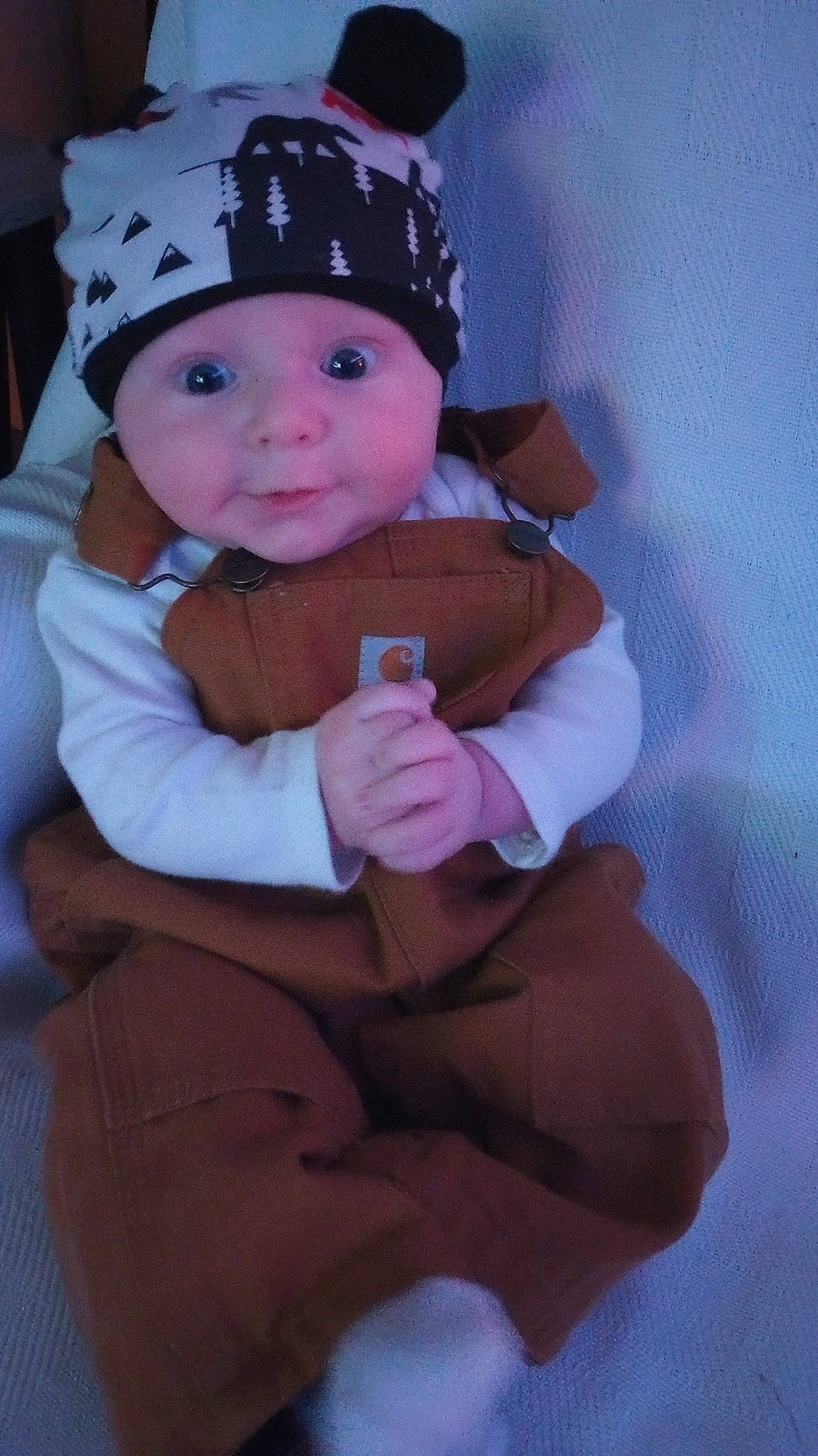 Mavrick Dale is registered to the contest to win money with this photo: baby, baby_toddler_clothing, cap, cheek, child, comfort, costume, costume_hat, fashion_accessory, fun, fur, hat, headgear, headwear, human_leg, knee, lap, person, pink, sitting