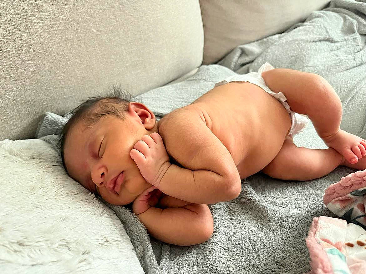 Valencia joined the competition — help win amazing prizes! abdomen, arm, baby, chest, child, comfort, diaper, human, human_body, human_leg, knee, linens, mammal, mouth, muscle, person, skin, stomach, thigh, toddler