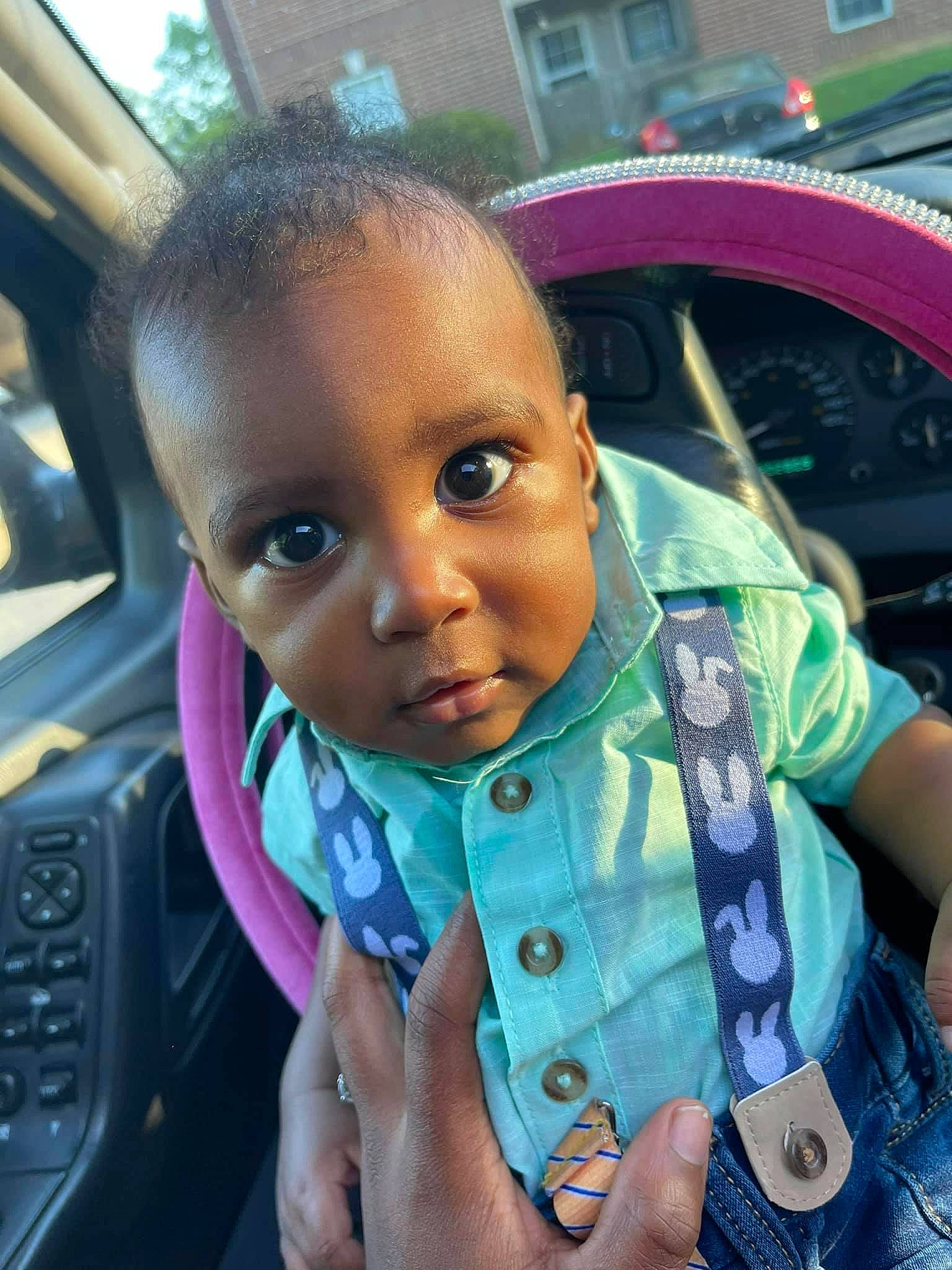 Jeremiah is registered to the contest to win money with this photo: auto_part, automotive_exterior, baby_toddler_clothing, car, car_seat, child, cool, dress, face, finger, fun, hairstyle, happy, motor_vehicle, person, skin, steering_wheel, thumb, toddler, vehicle_door