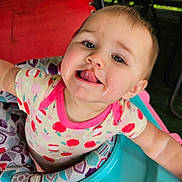 Ivery joined the competition — help win amazing prizes! baby, child, tongue_out, onesie, baby_walker, playful, rosy_cheeks, indoor, colorful, patterned_clothing, infant, cute, smiling, face, person, seat, toy, closeup, happy, young_child