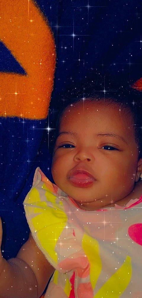 Taraji is registered to the contest to win money with this photo: art, cheek, child, chin, eyebrow, eyelash, facial_expression, forehead, fun, happy, iris, lip, magenta, nose, orange, person, pink, smile, snow, space