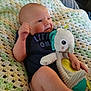 Brolee joined the competition — help win amazing prizes! baby, infant, plush_toy, elephant_toy, crocheted_blanket, blue_onesie, diaper, indoor, cute, child, soft_toy, relaxed, seated, hand, legs, expression, cozy, knitted, comfort, person