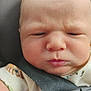 Brolee joined the competition — help win amazing prizes! baby, face, expression, car_seat, straps, onesie, infant, close_up, child, seatbelt, serious, grumpy, skin, head, young, person, indoors, baby_clothing, seat, child_seat