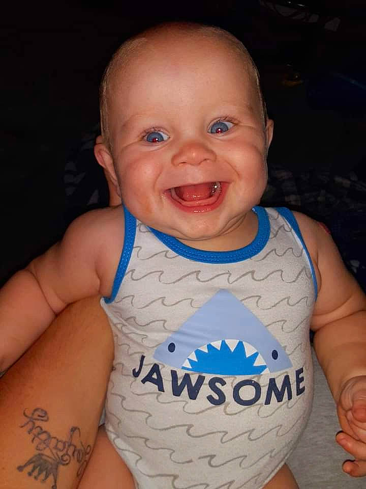 Kayson is registered to the contest to win money with this photo: arm, baby, baby_toddler_clothing, cheek, chest, chin, eye, finger, happy, iris, joy, lip, mouth, neck, nose, person, sleeve, smile, stomach, t_shirt