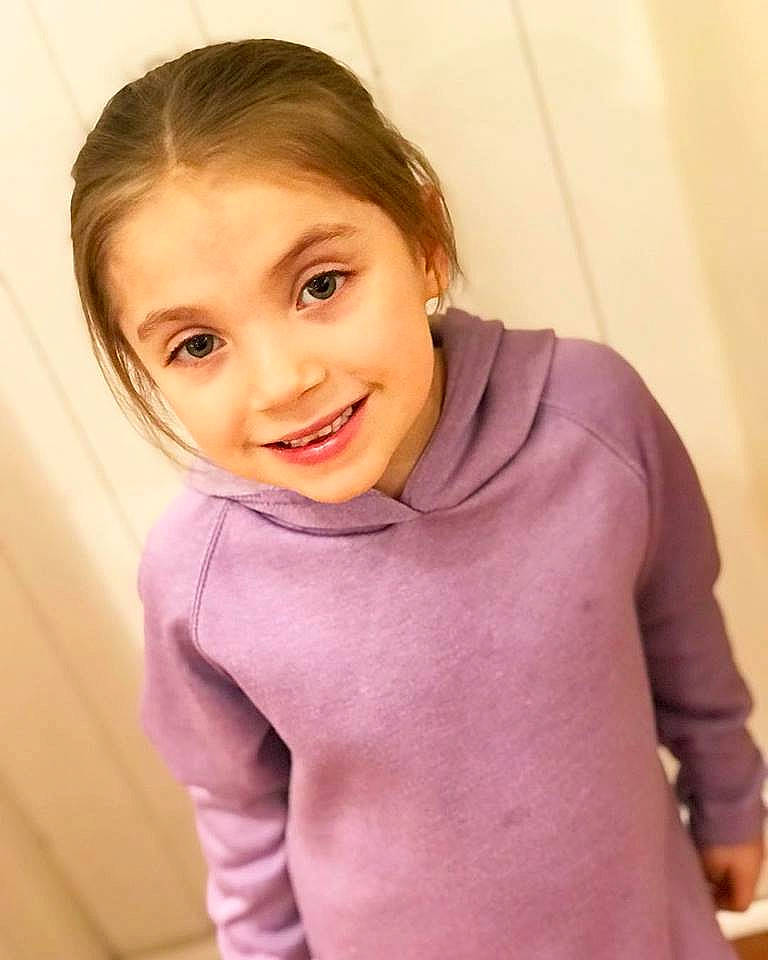 Peyton is registered to the contest to win money with this photo: baby, beauty, blond, cheek, child, chin, face, facial_expression, forehead, hair, head, joy, lip, neck, nose, outerwear, person, pink, shoulder, skin