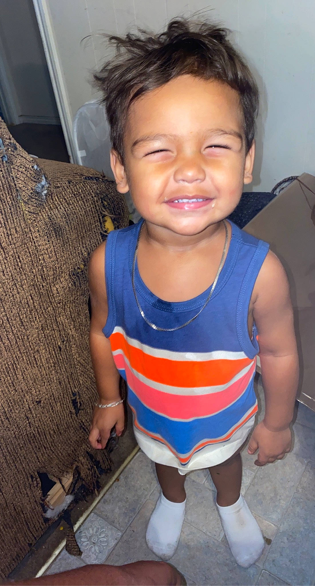 Renzo is registered to the contest to win money with this photo: baby_toddler_clothing, cheek, chin, eye, face, facial_expression, forehead, hair, head, human, joint, joy, leg, mouth, neck, nose, organ, person, skin, sleeve