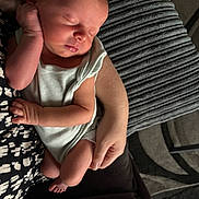 Harrison is registered to the contest to win money with this photo: baby, newborn, sleeping, infant, arms, hand, face, cushion, blanket, clothing, person, resting, cozy, indoor, closeup, tender, soft, peaceful, human, skin