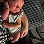 baby, newborn, sleeping, infant, arms, hand, face, cushion, blanket, clothing, person, resting, cozy, indoor, closeup, tender, soft, peaceful, human, skin