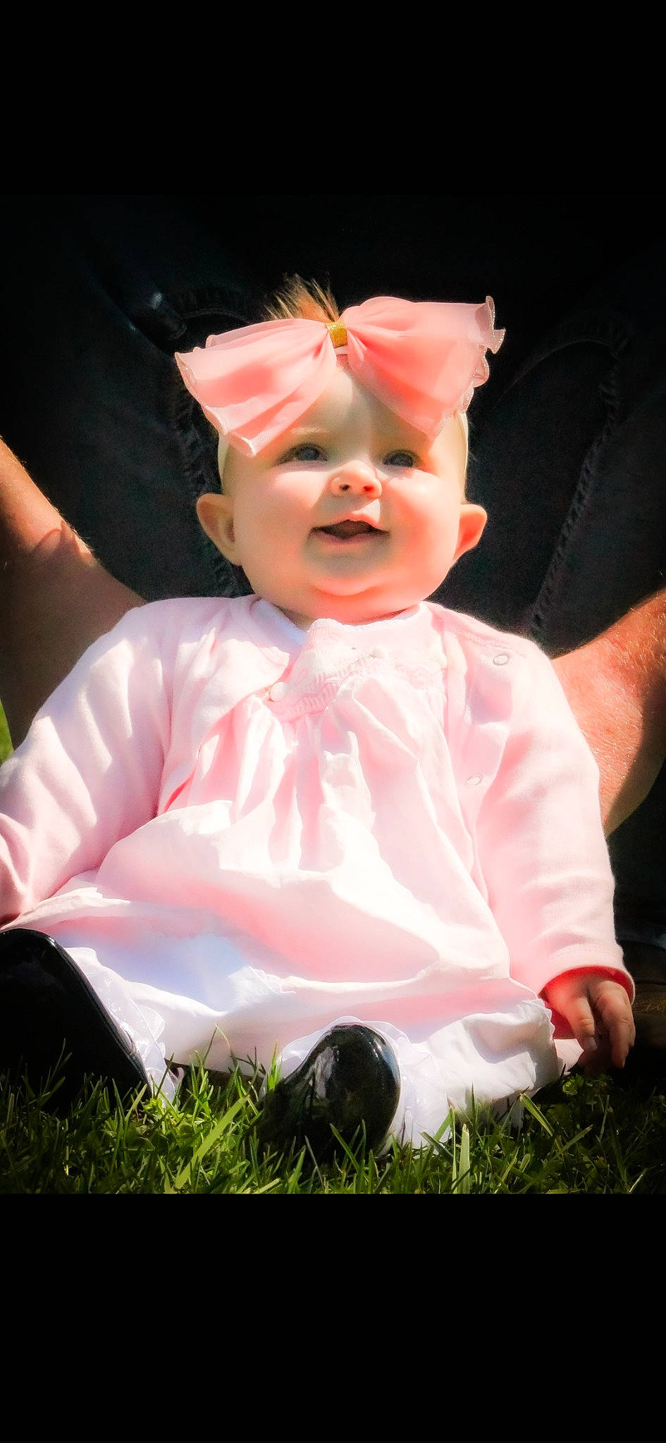 Oaklan is registered to the contest to win money with this photo: baby, baby_toddler_clothing, cheek, child, costume, entertainment, event, fictional_character, flash_photography, fun, gesture, grass, happy, peach, person, pink, sitting, sleeve, thumb, toddler