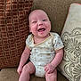 Alex joined the competition — help win amazing prizes! baby, smiling, infant, couch, onesie, teddy_bear_print, cushion, patterned_cushion, happy, sitting, indoors, cute, child, person, skin, head, arm, leg, home, cozy