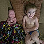 Alex joined the competition — help win amazing prizes! baby, child, toddler, smile, couch, blanket, pillow, indoor, happy, sitting, barefoot, patterned, clothing, person, face, infant, relaxing, cute, young, home