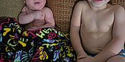 Alex joined the competition — help win amazing prizes! baby, toddler, child, blanket, couch, pillow, smile, shirtless, indoor, patterned, happy, person, sitting, face, head, skin, young, cozy, family, home