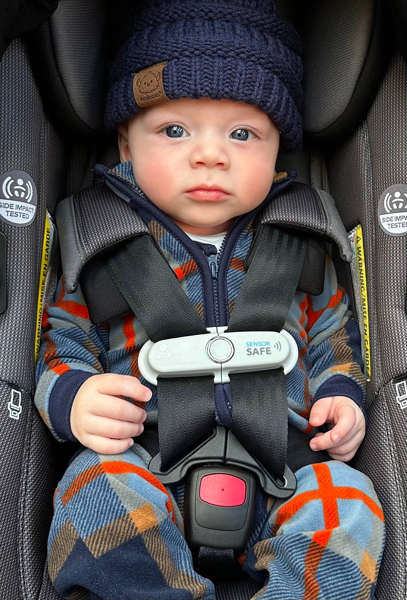 Julian is registered to the contest to win money with this photo: accessories, baby, belt, bodypart, cap, car, clothing, coat, face, finger, hand, hat, head, jacket, pants, person, photography, portrait, transportation, vehicle
