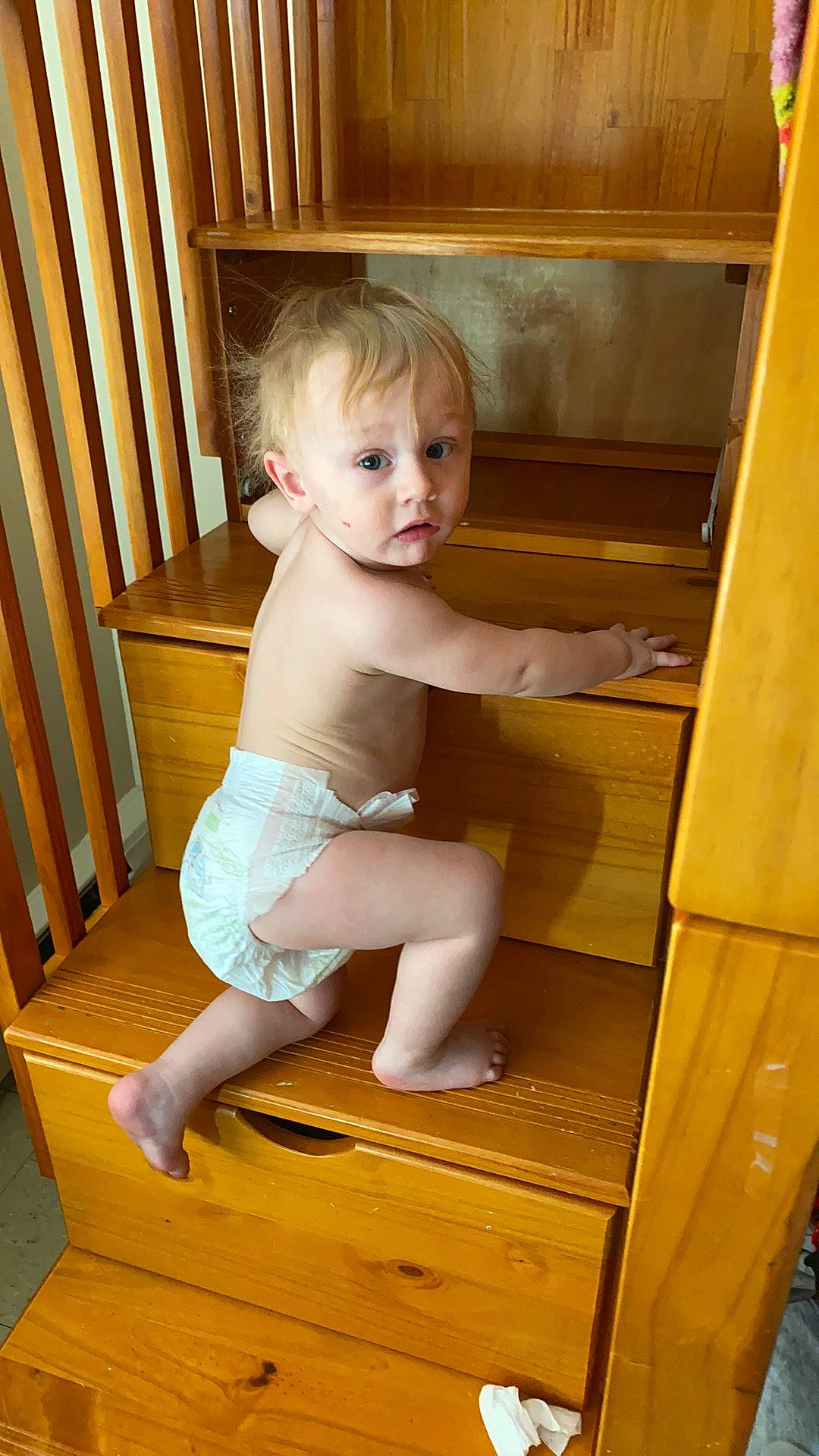 Grayson is registered to the contest to win money with this photo: baby, baby_toddler_clothing, barefoot, calf, chair, chest, child, comfort, flooring, foot, fun, hardwood, human_leg, knee, person, room, sitting, surprise, thigh, toddler