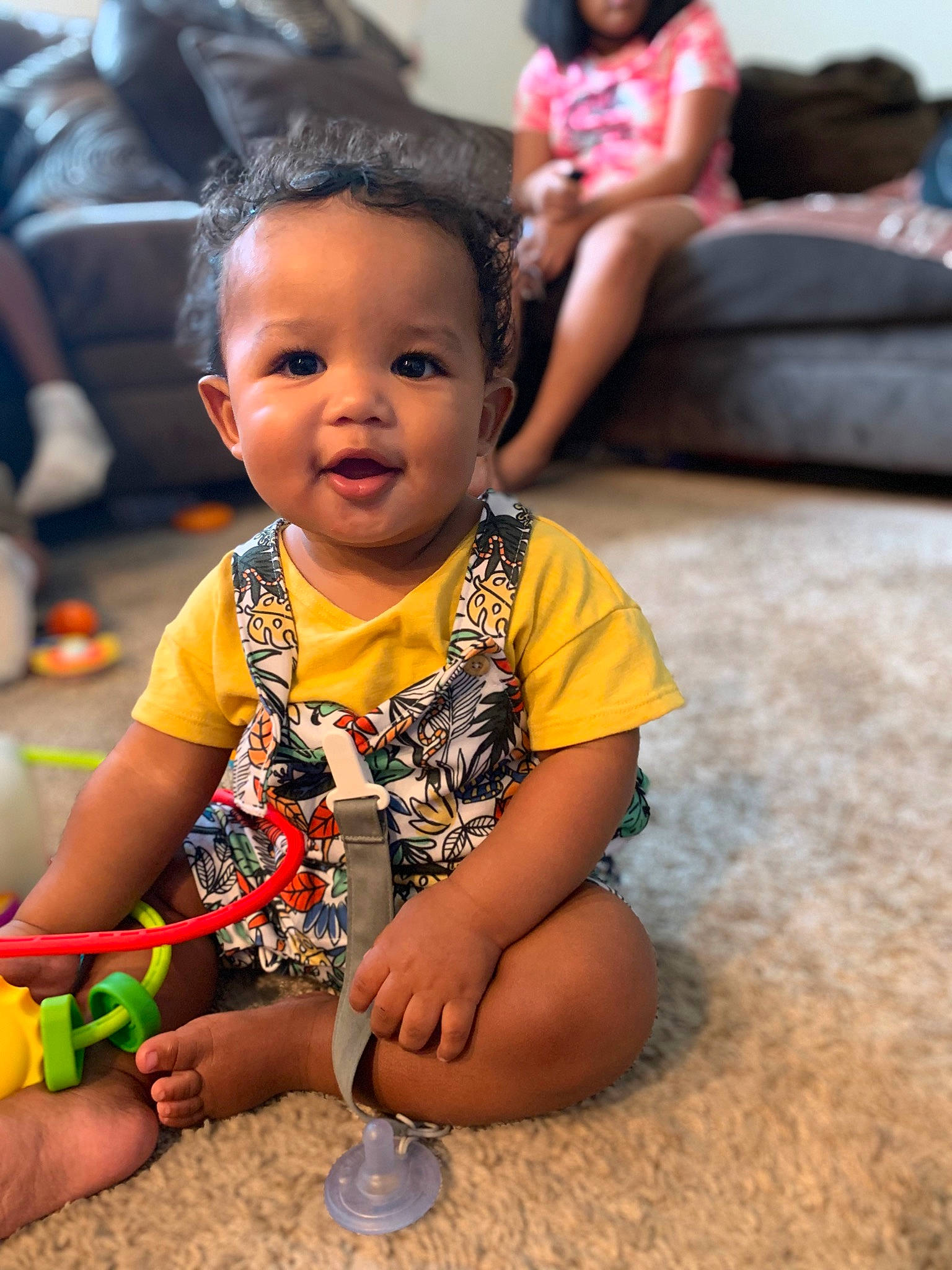 Chandler is registered to the contest to win money with this photo: baby, baby_toddler_clothing, beauty, child, event, finger, flooring, fun, hand, happy, human, leisure, people, person, recreation, sitting, skin, smile, snapshot, summer