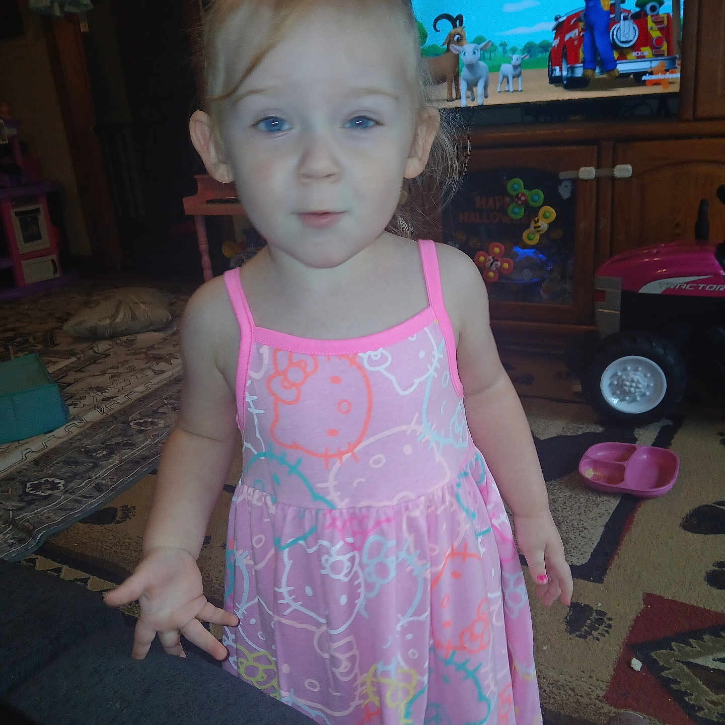 Roe joined the competition — help win amazing prizes! bow, carpet, carpet_pattern, cartoon, child, dress, expression, face, floor, footwear, furniture, hand, hello_kitty, indoor, living_room, person, pink, television, toddler, toy