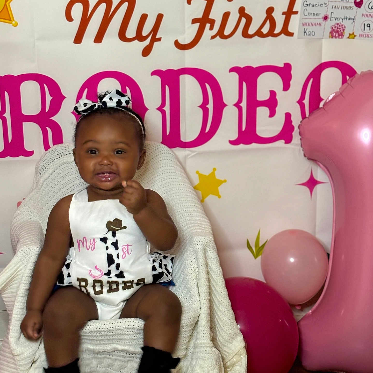 Kaomi is registered to the contest to win money with this photo: accessories, baby, balloon, clothing, couch, face, footwear, furniture, hat, head, homedecor, jewelry, people, person, photography, portrait, purple, shoe, sitting, t_shirt