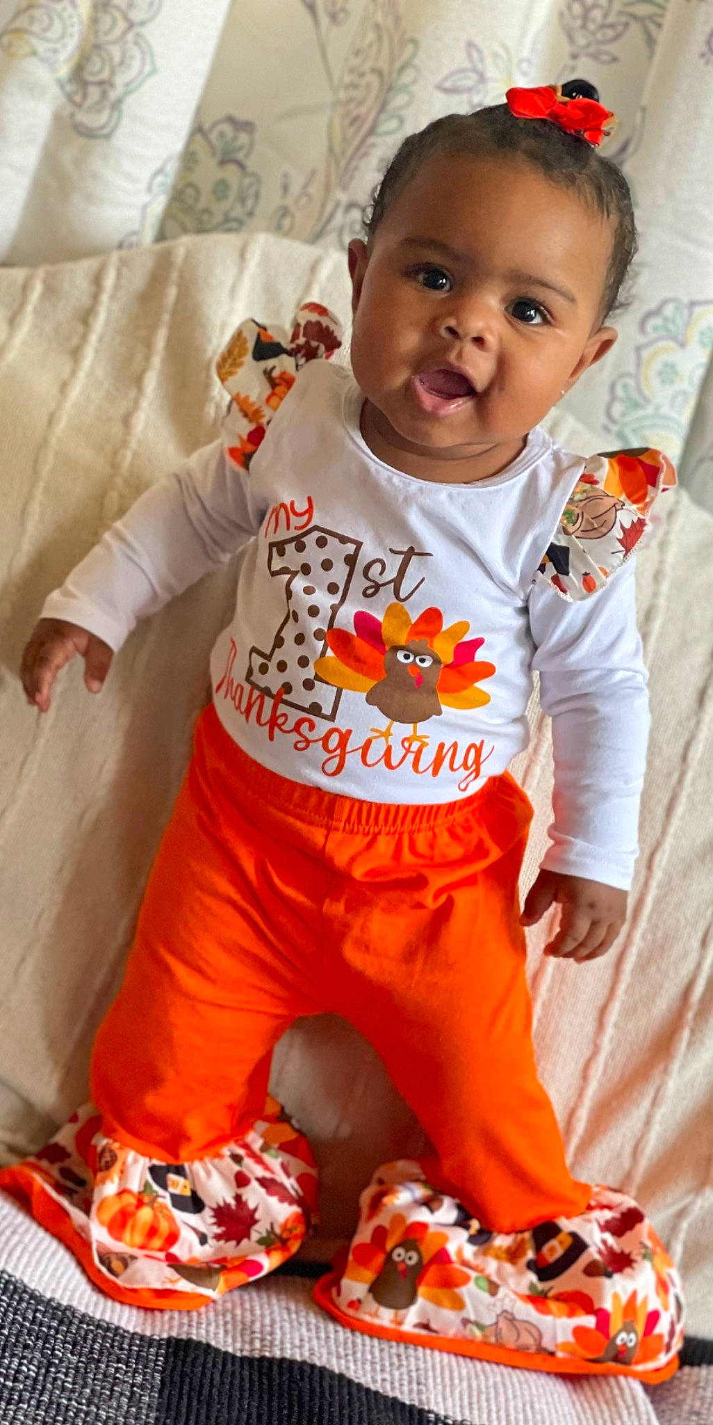 Everleigh joined the competition — help win amazing prizes! active_pants, baby, baby_toddler_clothing, child, eye, face, flooring, happy, head, orange, outerwear, pattern, people, person, personal_protective_equipment, skin, sleeve, sportswear, t_shirt, textile