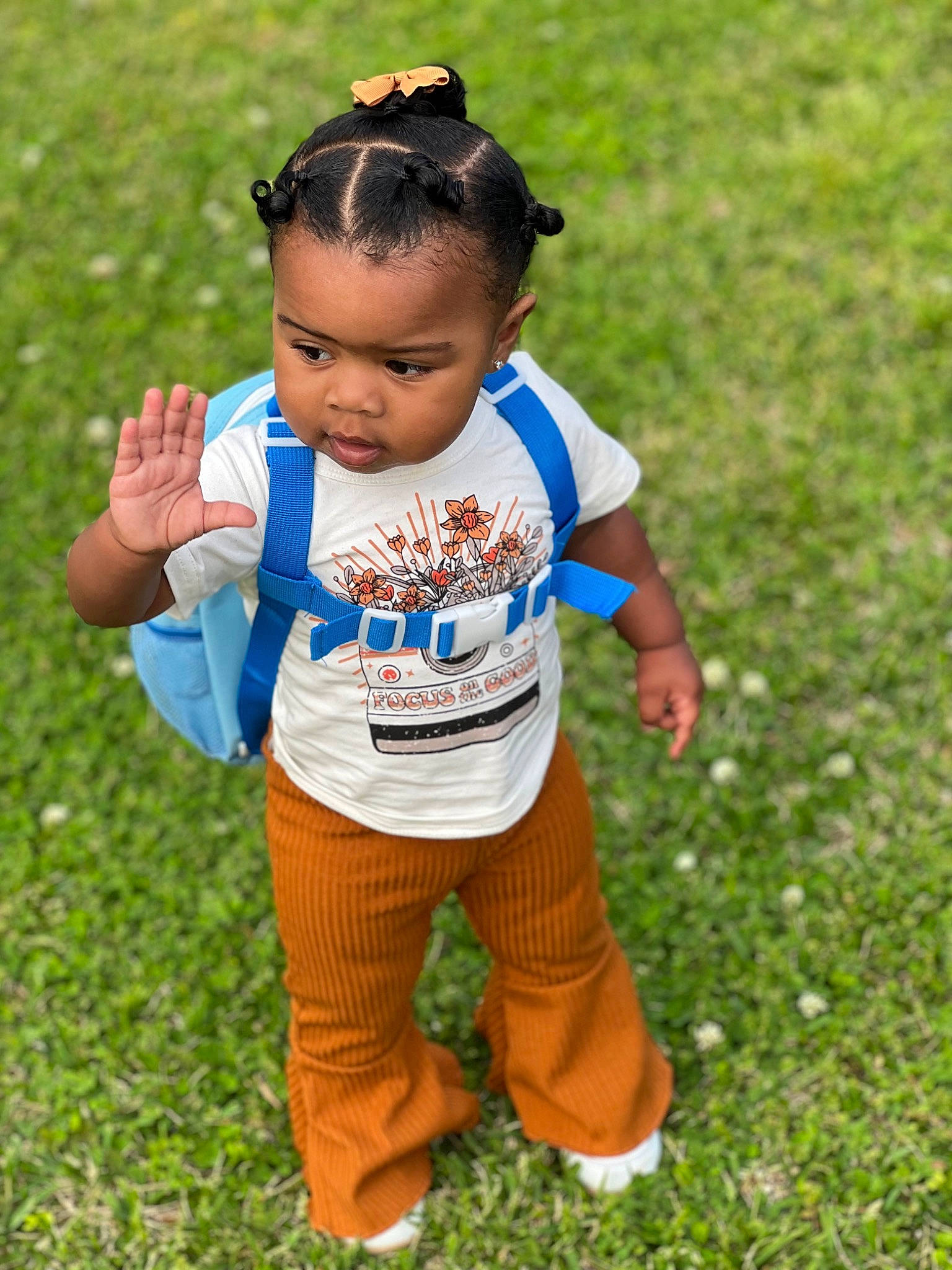 Everleigh is registered to the contest to win money with this photo: baby, baby_toddler_clothing, child, electric_blue, face, fun, grass, grass_family, grassland, happy, head, leisure, people_in_nature, person, play, recreation, sleeve, soil, t_shirt, toddler