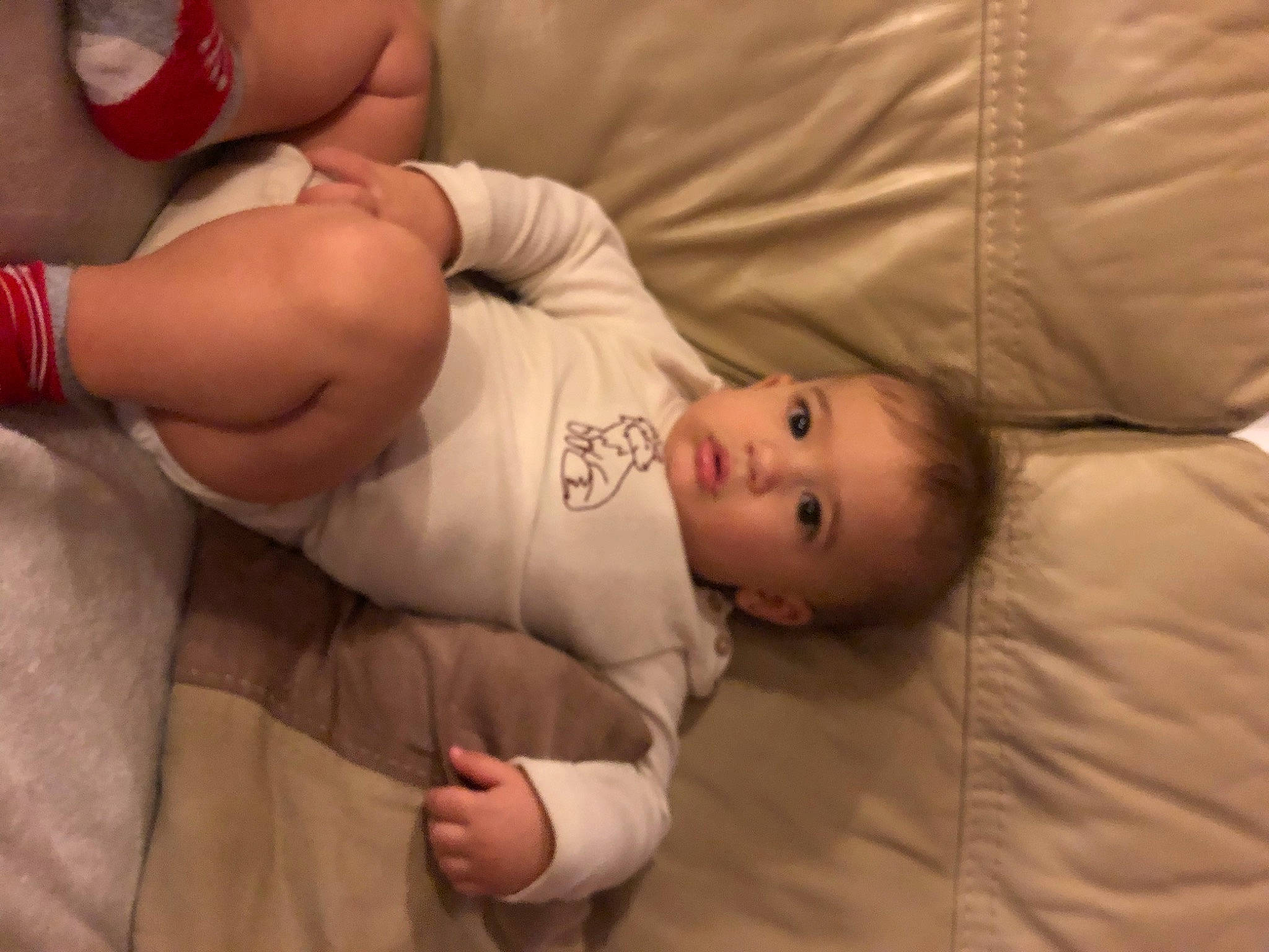 Stefan is registered to the contest to win money with this photo: ankle, baby, baby_products, baby_toddler_clothing, carmine, cheek, child, comfort, finger, foot, joint, nail, nightwear, organ, person, skin, sleeve, slipper, sock, toddler