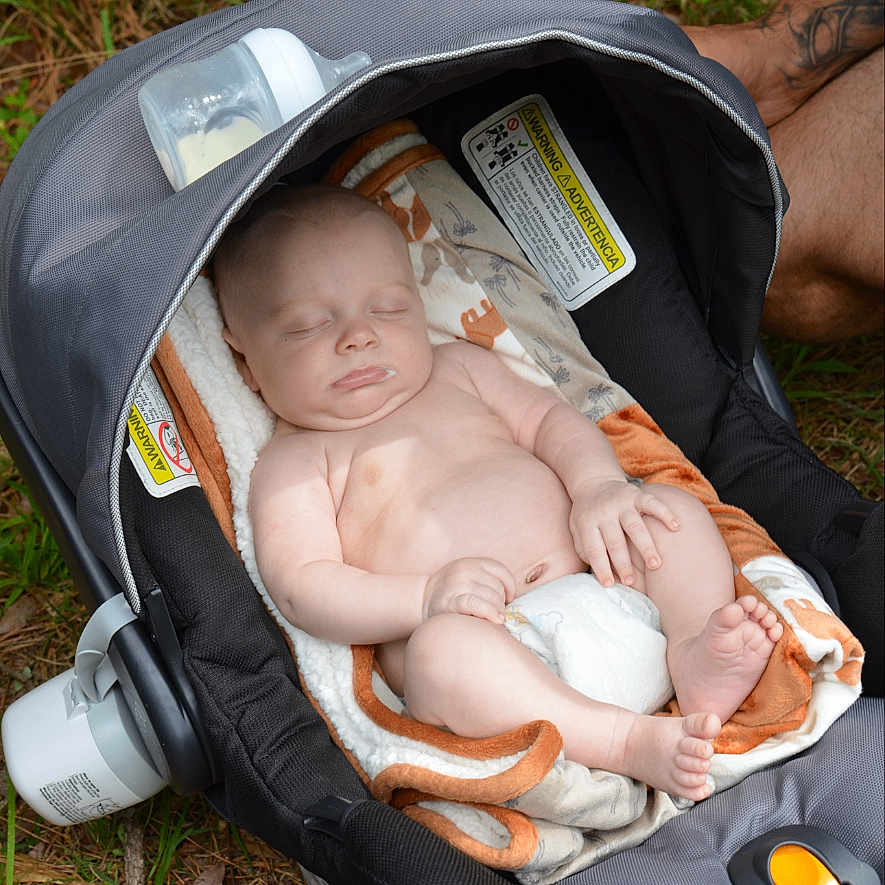 Koen joined the competition — help win amazing prizes! baby, blanket, bottle, car_seat, casual, child, comfort, diaper, grass, infant, napping, nature, outdoor, peaceful, person, relaxing, rest, sleeping, soft, tattoo