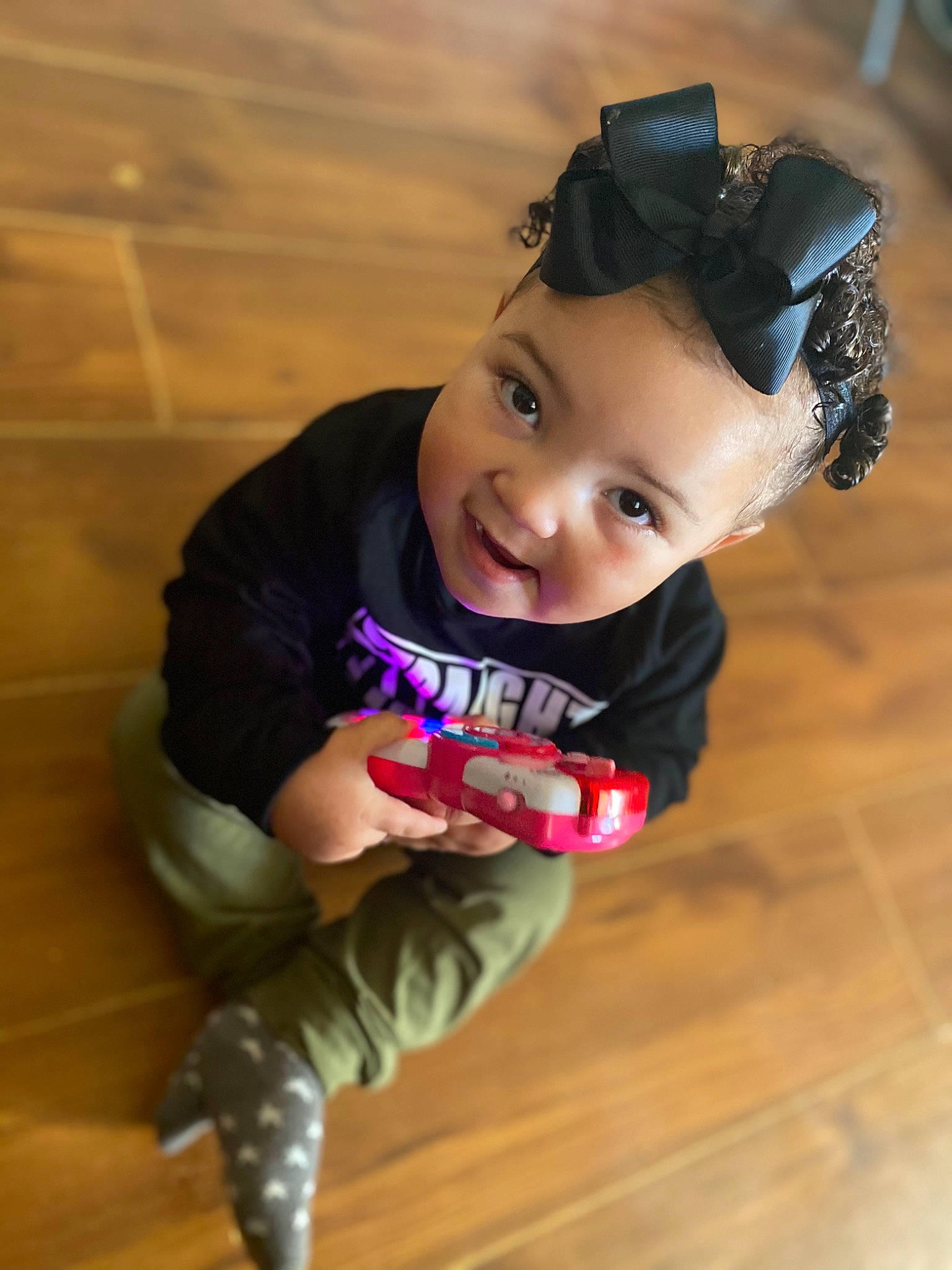 Alyson is registered to the contest to win money with this photo: baby, baby_laughing, baby_toddler_clothing, boot, cheek, child, child_model, costume, costume_accessory, floor, flooring, hair_accessory, headband, headpiece, laminate_flooring, person, sock, toddler, wood_flooring