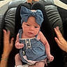 baby, blue_bow, denim_dress, white_socks, hands, lap, person, indoor, carpet, black_pants, skin, cute, infant, headband, blurred_motion, furniture, couch, relaxation, child, human