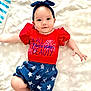 Ailynn is registered to the contest to win money with this photo: baby, infant, headband, red_shirt, blue_shorts, stars_pattern, lying_down, blanket, cute, child, smiling, portrait, apparel, people, one_person, indoor, soft_lighting, happy, young_child, baby_clothes