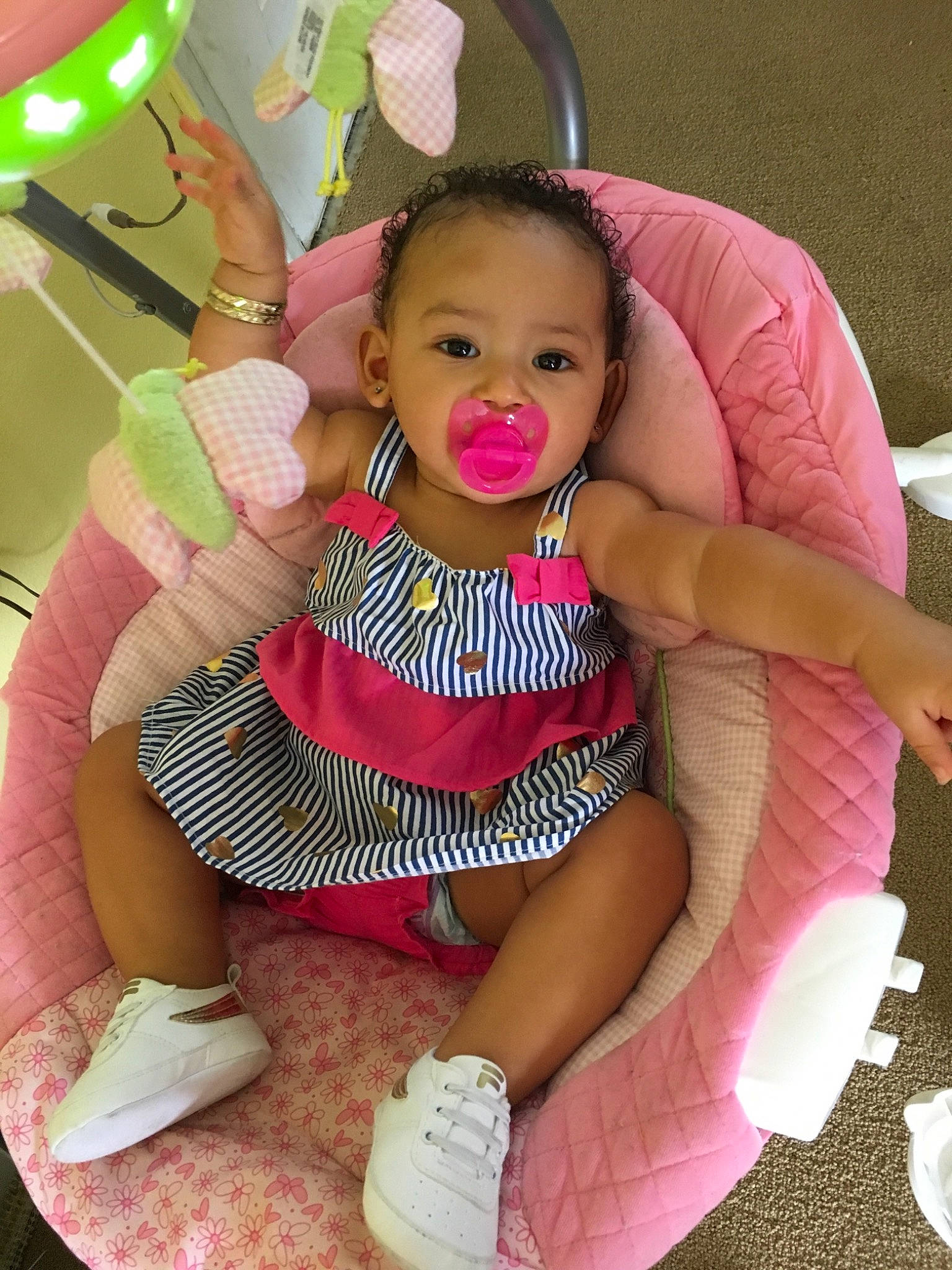 Kayla joined the competition — help win amazing prizes! baby, baby_products, baby_toddler_clothing, chair, child, comfort, facial_expression, finger, fun, hand, happy, leisure, magenta, person, pink, shoe, skin, sneakers, thigh, toddler