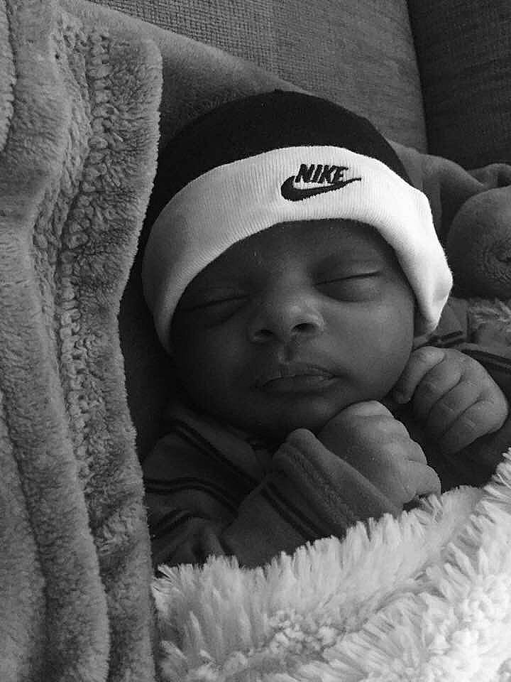 Amarion is registered to the contest to win money with this photo: baby, bedtime, black, black_and_white, child, eye, face, hand, headgear, headwear, monochrome, monochrome_photography, nap, person, photograph, photography, skin, sleep, smile, snapshot