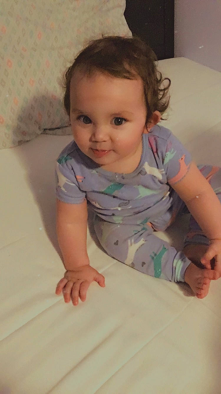 Evy is registered to the contest to win money with this photo: arm, baby, baby_toddler_clothing, cheek, child, crawling, eye, face, finger, hand, head, nose, person, sitting, skin, smile, toddler