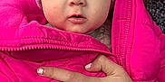 Rori is registered to the contest to win money with this photo: baby, child, hat, pink_jacket, pom_pom, hand, nail_polish, pen_marks, forest, car_interior, winter_clothing, cozy, cute, portrait, outdoor_background, warm_clothes, infant, person, face, expression